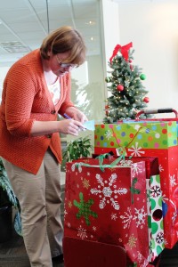 Photos by Mike Nemeth After loading a hand truck with gifts for foster children, Cara Layne makes sure everything is in order. Layne, CAA's human resources administrator and senior accountant, spearheaded this year's CAA toy drive for Sierra Forever Families.