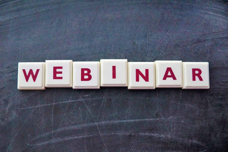 Board pieces that spell out webinar